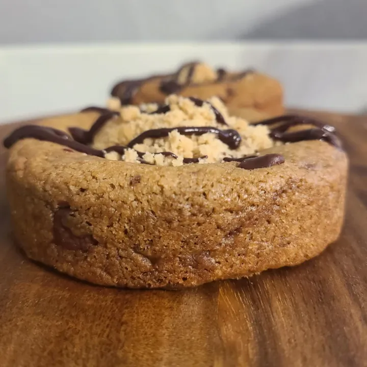 Stuffed cookie with chocolate drizzle from Battered Dough